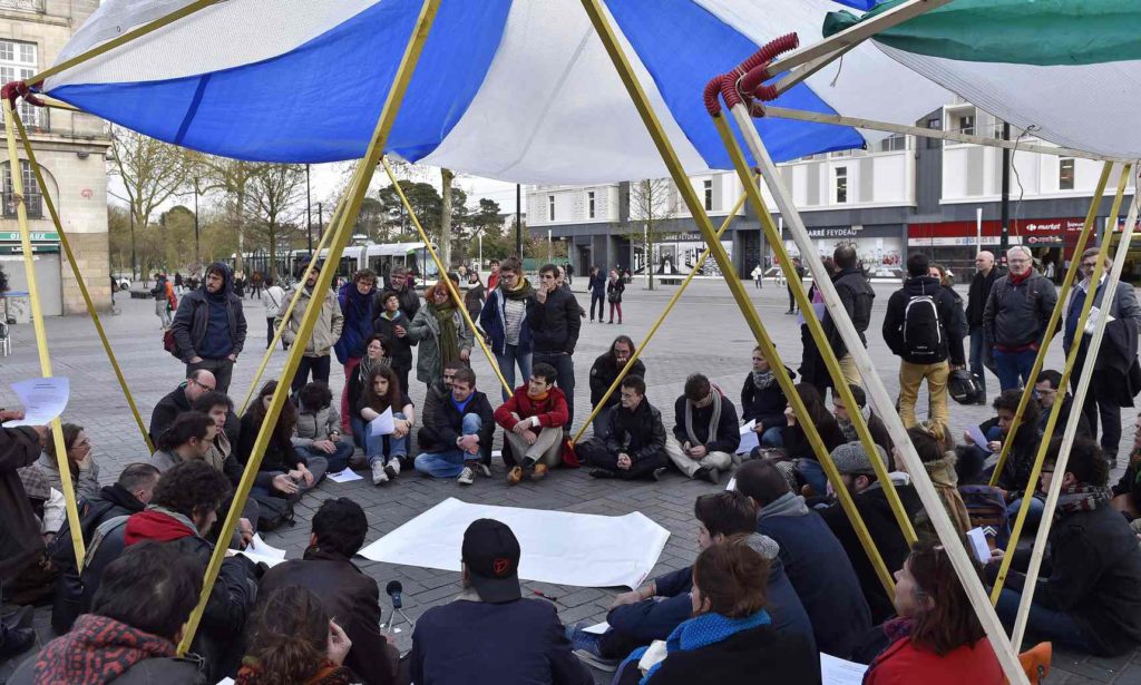 Protesters debate issues such as national security, housing and proposed changes to French labour law. Photograph: Loic Venance/AFP/Getty Images